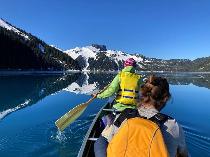 Chelsea Little, Nina Hewitt, Courtney Collins, and Noémie Boulanger-Lapointe canoeing