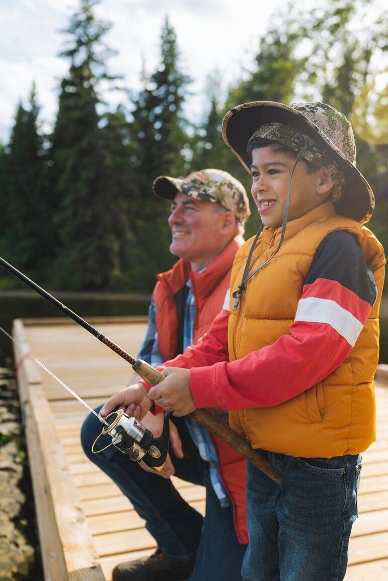 A peaceful lakeside lesson at Gwillim Lake Park, where a young angler discovers the joy of casting a line surrounded by the quiet beauty of nature. Courtesy of Destination BC