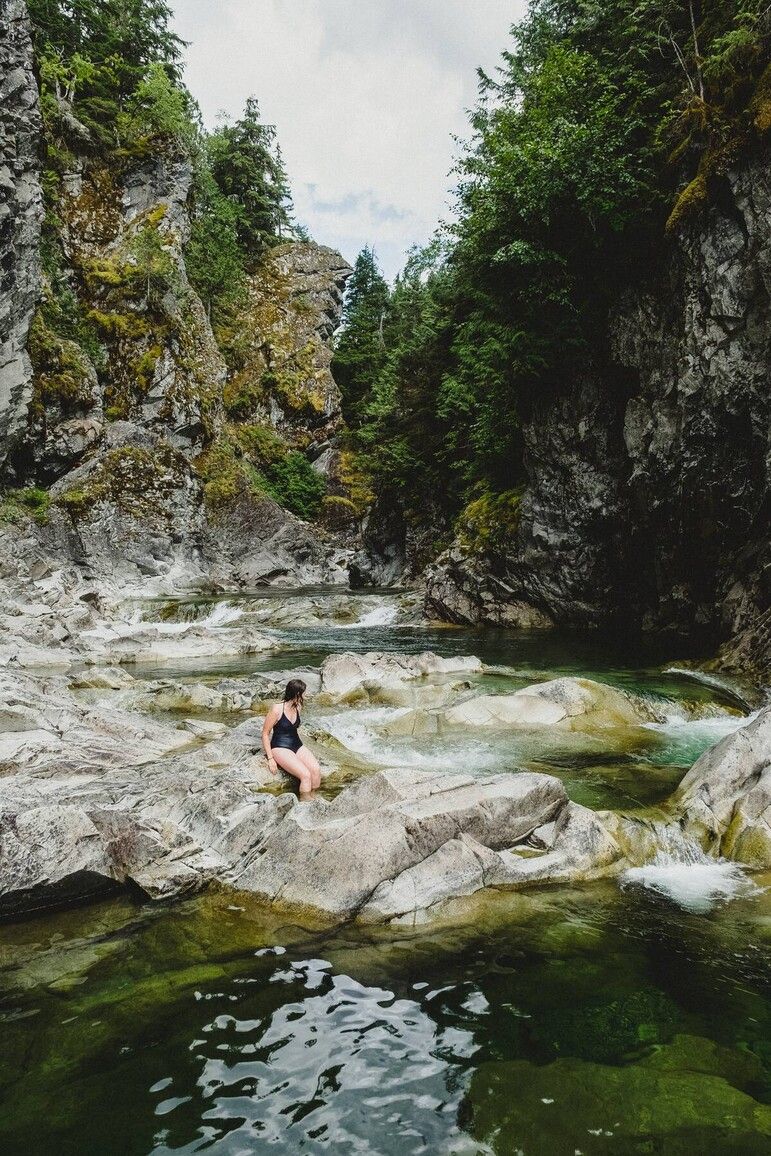 A visitor enjoys the cool waters Kleanza Creek. Courtesy of Destination BC