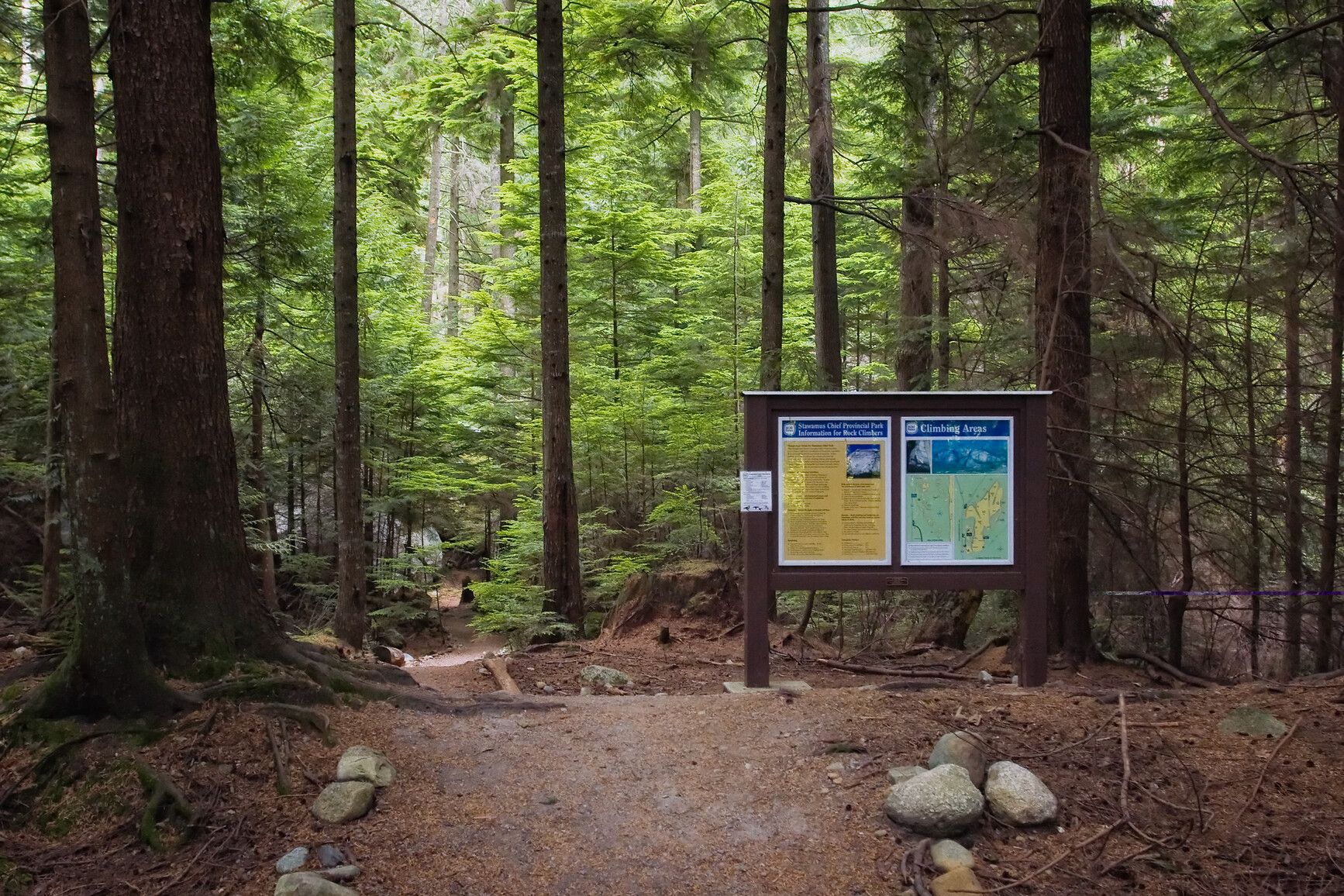 Park sign in forest at the entrance of a trail. Stawamus Chief Park.
