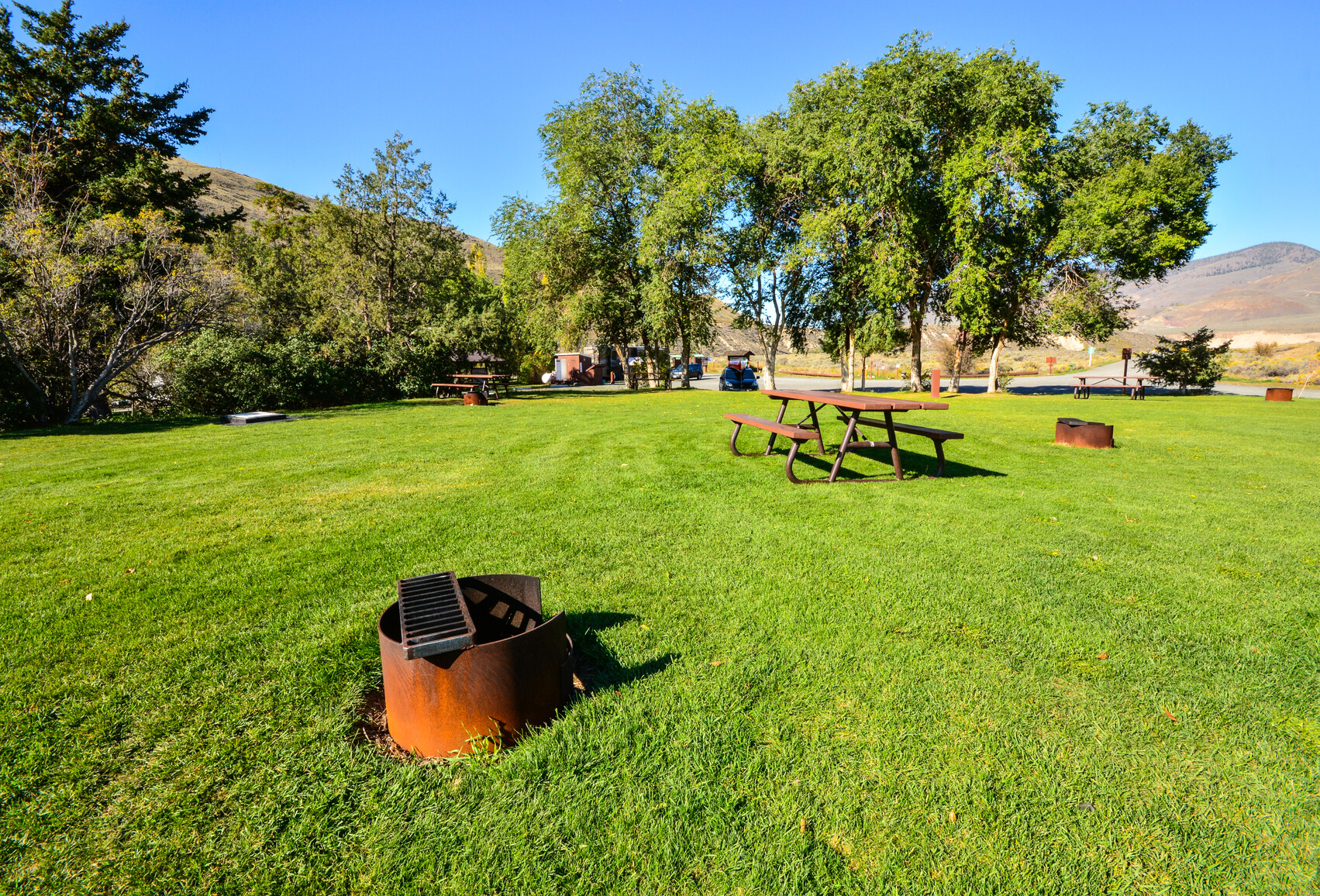 Campground with fire rings and picnic tables.