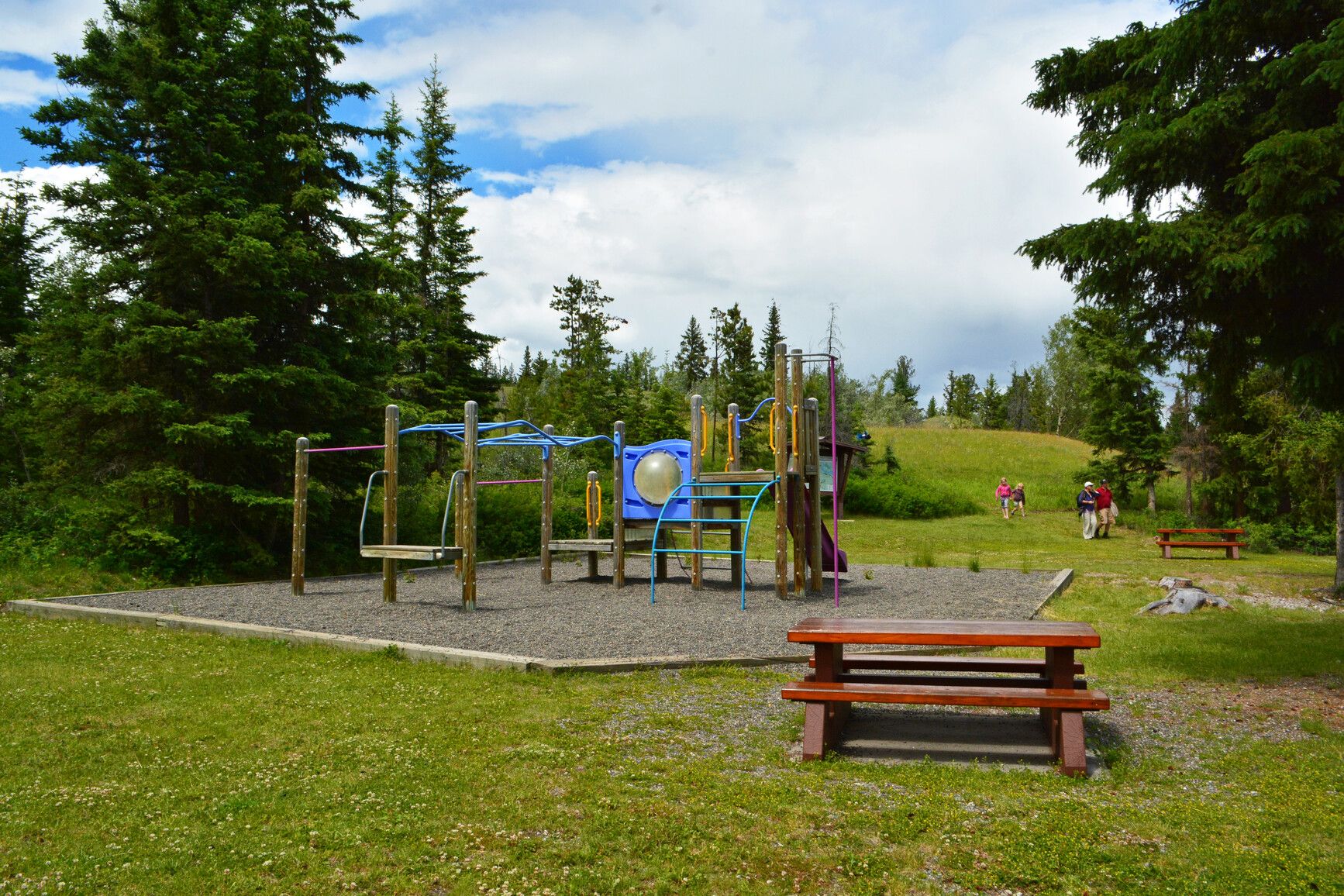 Discover the family outing spot at Big Bar Lake Park, where the playground area and picnic tables create an inviting place for outdoor activities with your kids.