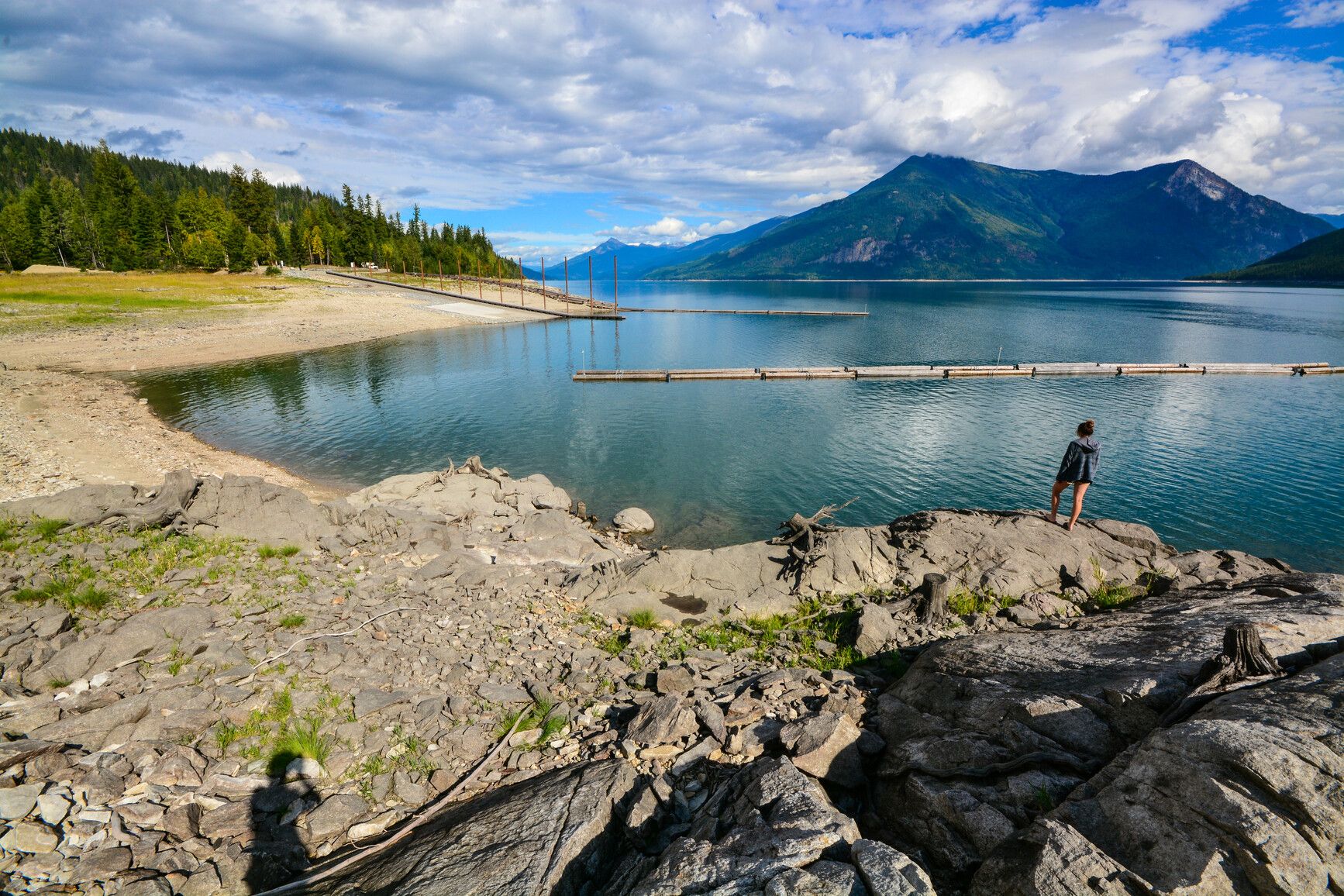 A park visitor enjoying the view of Arrow Lake in Arrow Lakes Provincial Park, Shelter Bay Site.
