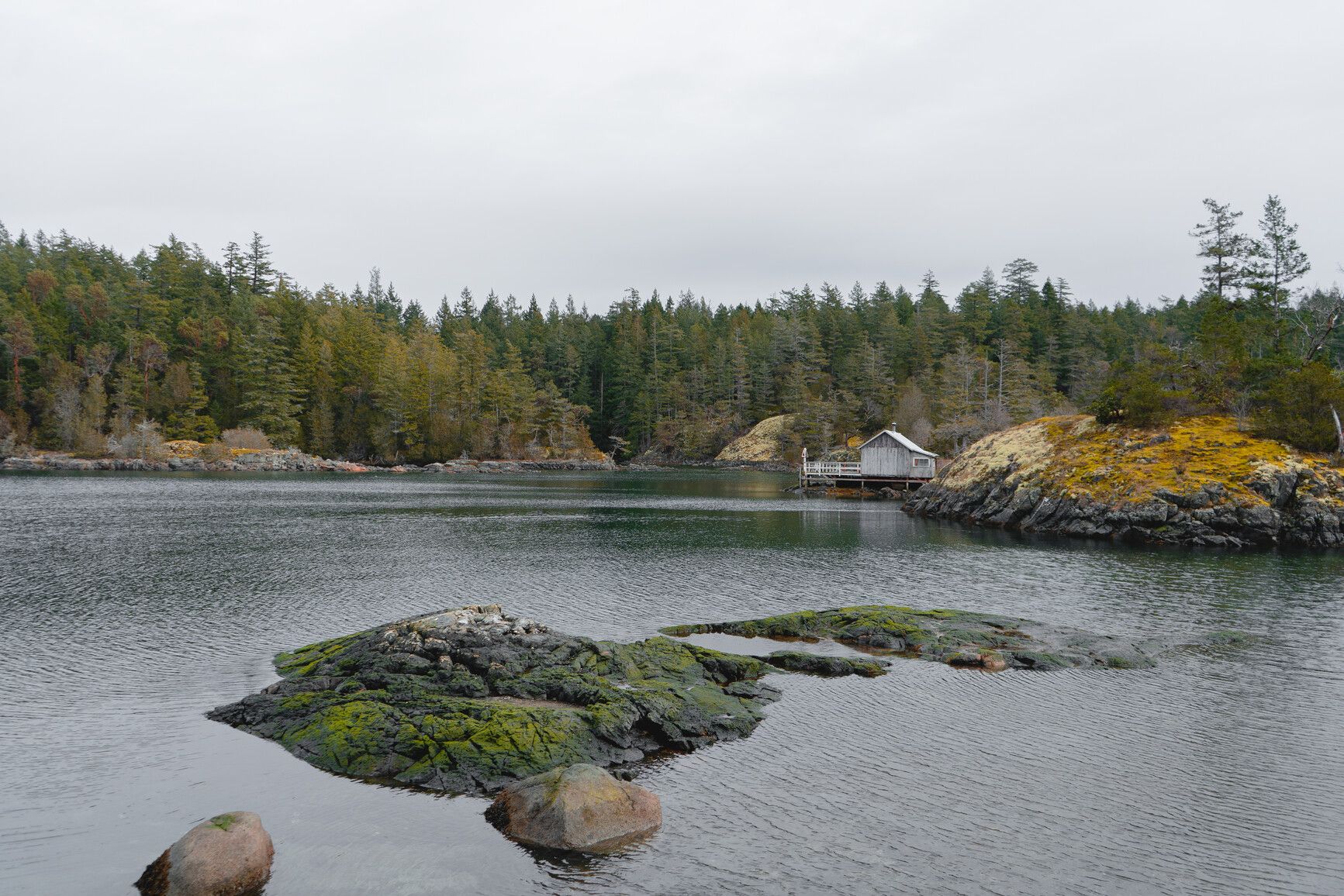 A view of Smuggler Cove Marine Park and a small home on the edge of the cove.