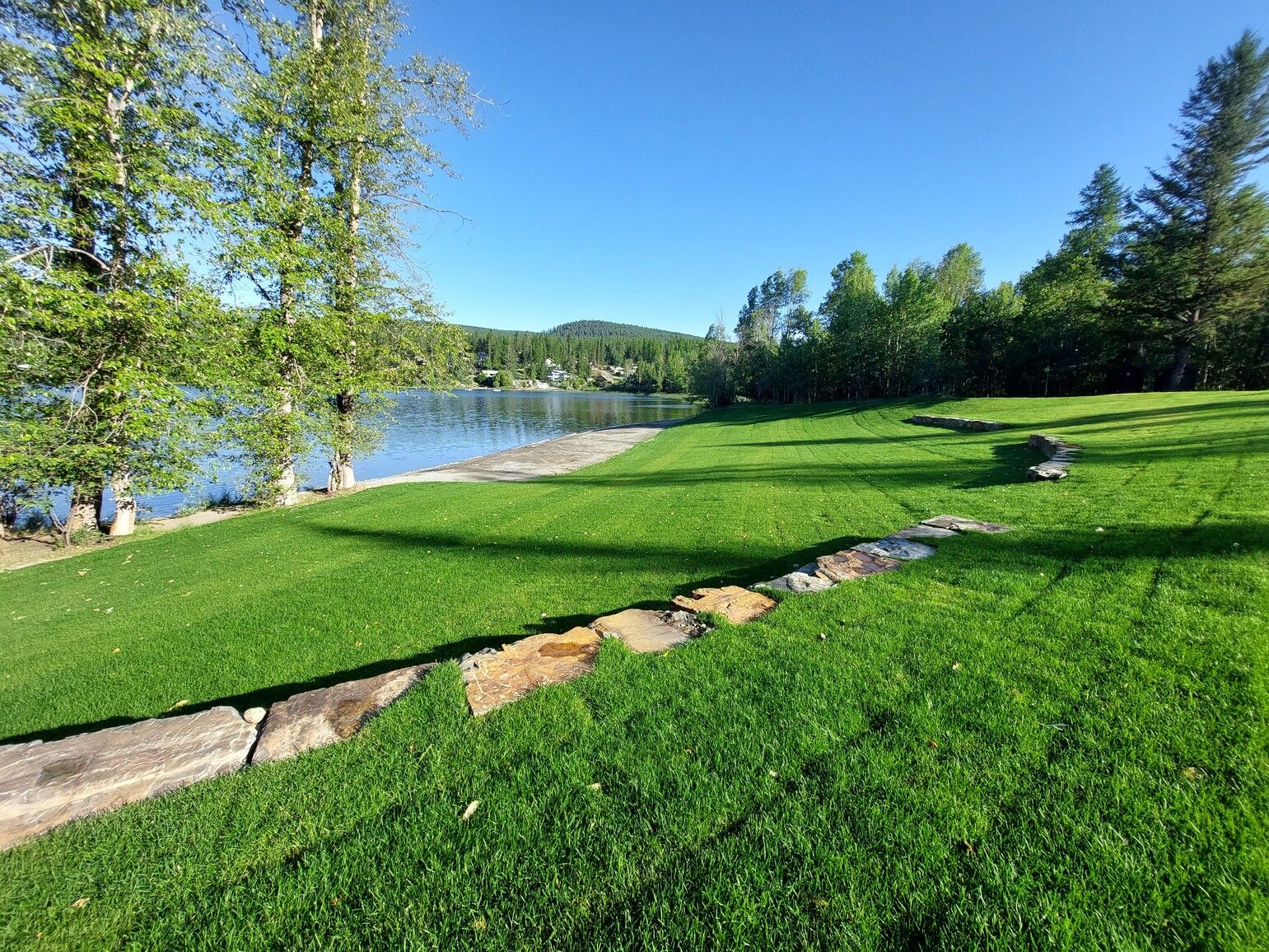 Day-use grass and beach area at Jimsmith Lake Park.