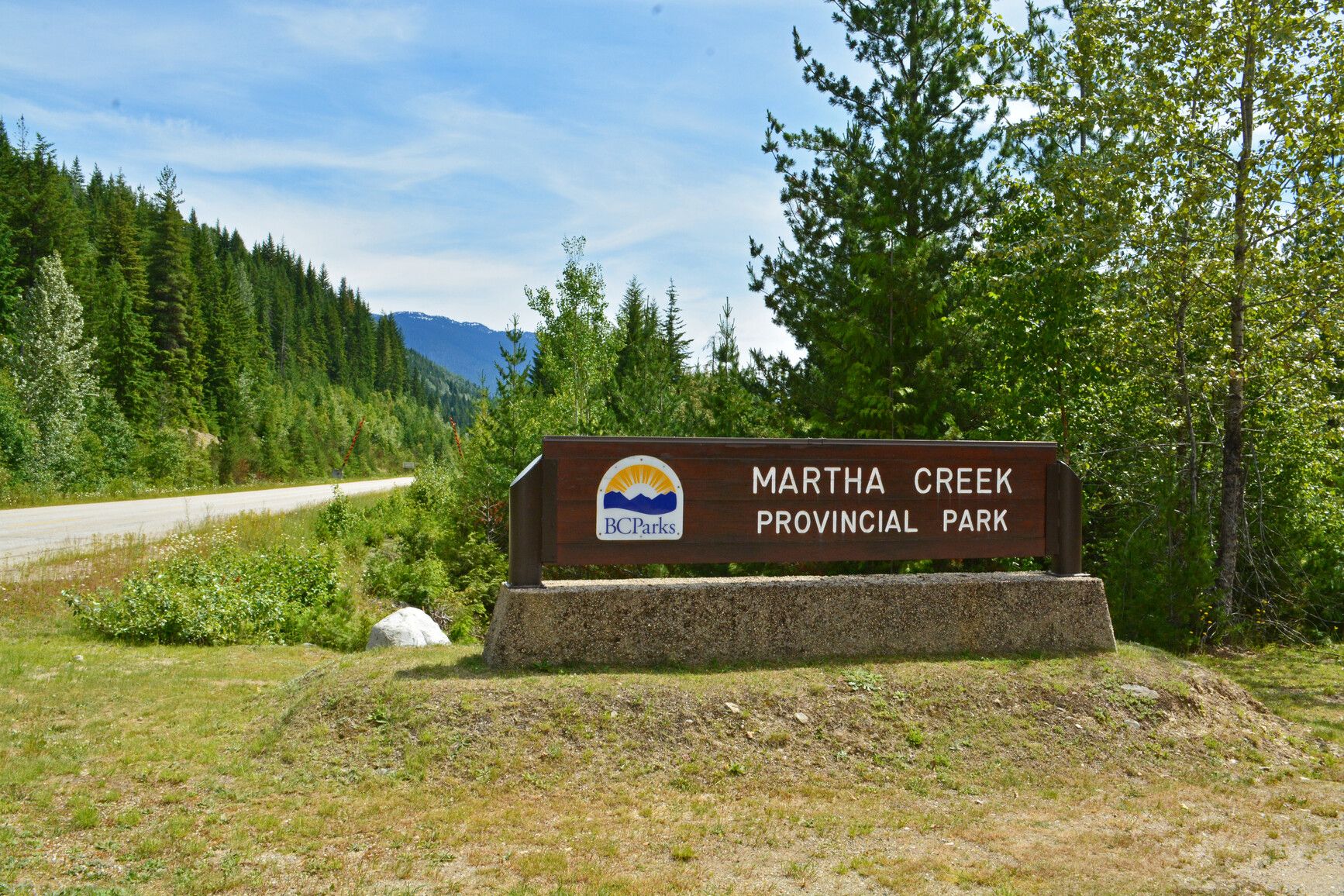 The entrance sign for Martha Creek Park beside the highway.