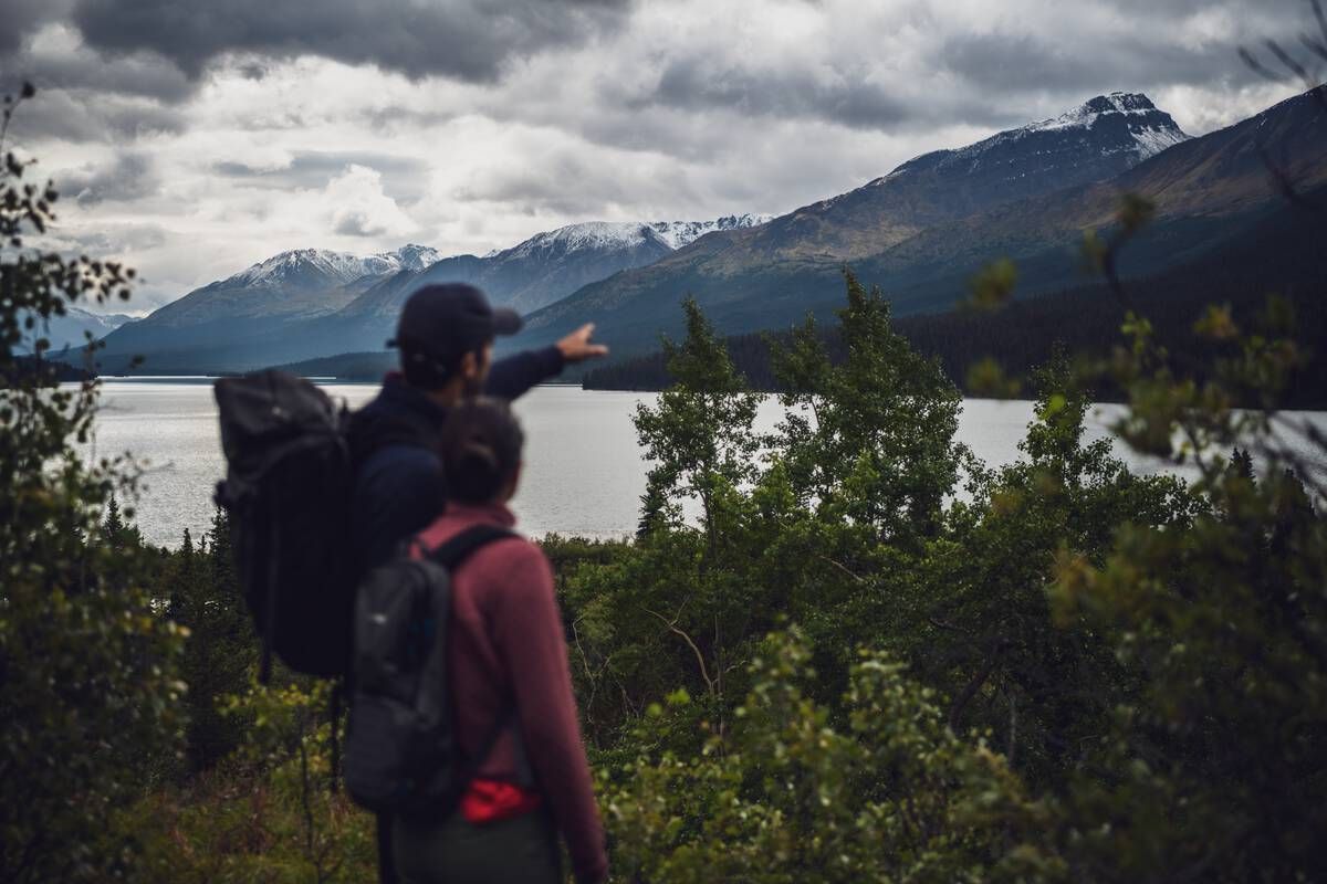 Cold Fish Lake in Spatsizi Plateau Wilderness Park offers a serene mountain setting with pristine waters and sweeping alpine views. Courtesy of Destination BC