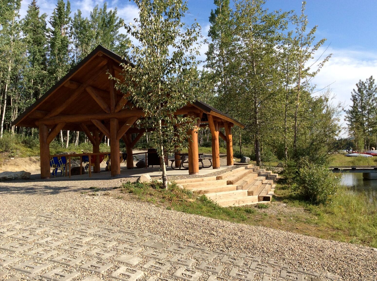 Beside the boat launch, a picnic shelter with stairs leads down to the lakeshore of Boya Lake, offering a perfect spot to relax, enjoy a meal, and take in the scenic views. Tā Ch'ilā Park.