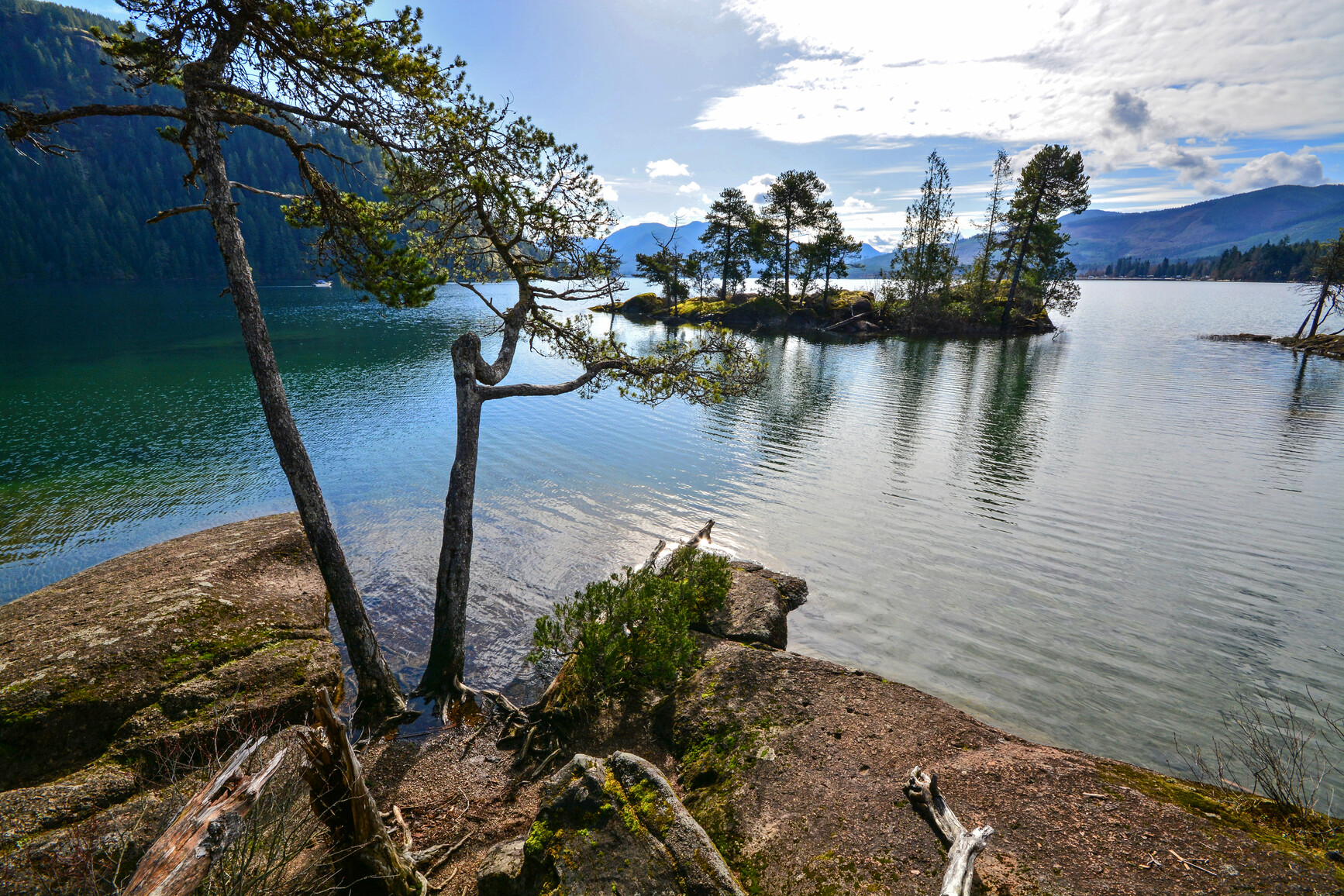 View of lake, island, mountains and forests.