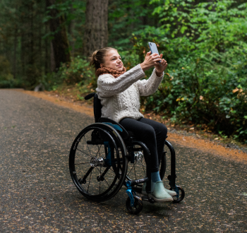 A child in a wheelchair on a trail