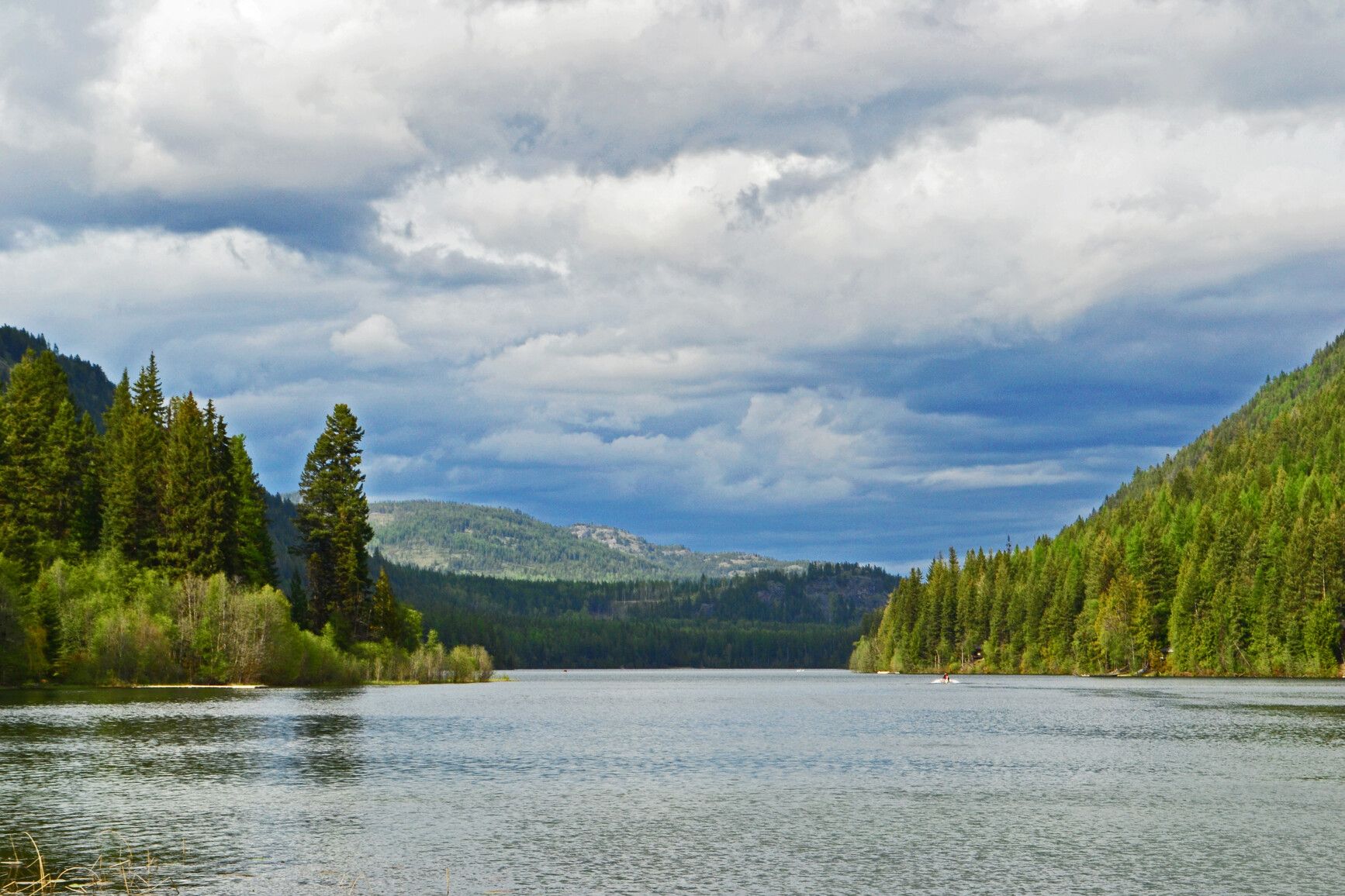Forest covered mountains surround Jewel Lake.