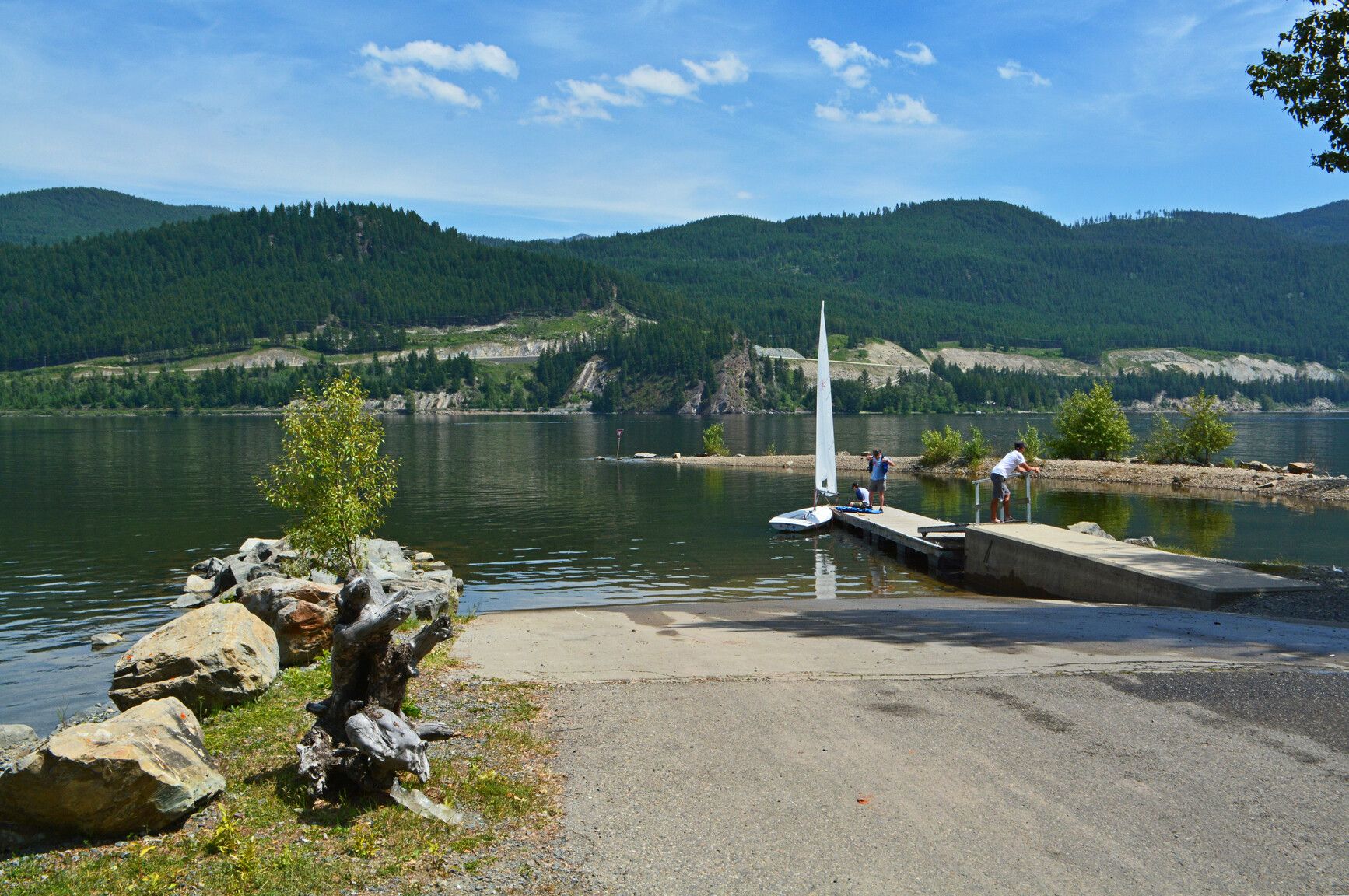 On the dock, boaters get ready for a relaxing sailboat ride on Moyie Lake.