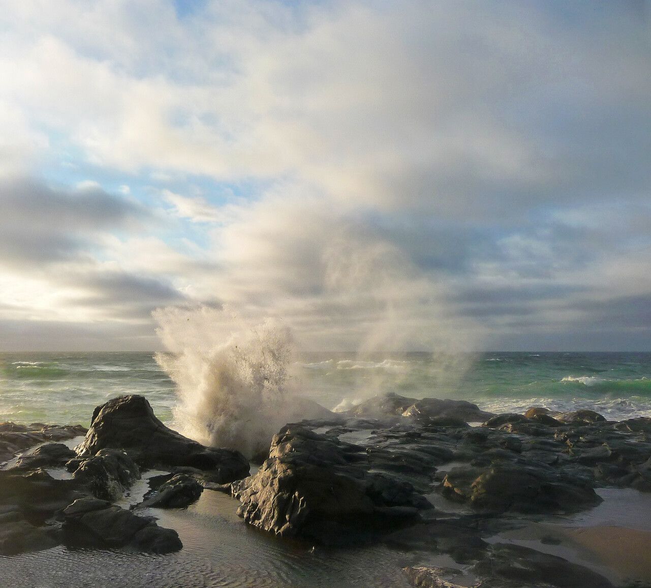 The Blow Hole in Naikoon Park is an underground catapult of water surge channels carved through the coastline rocks.