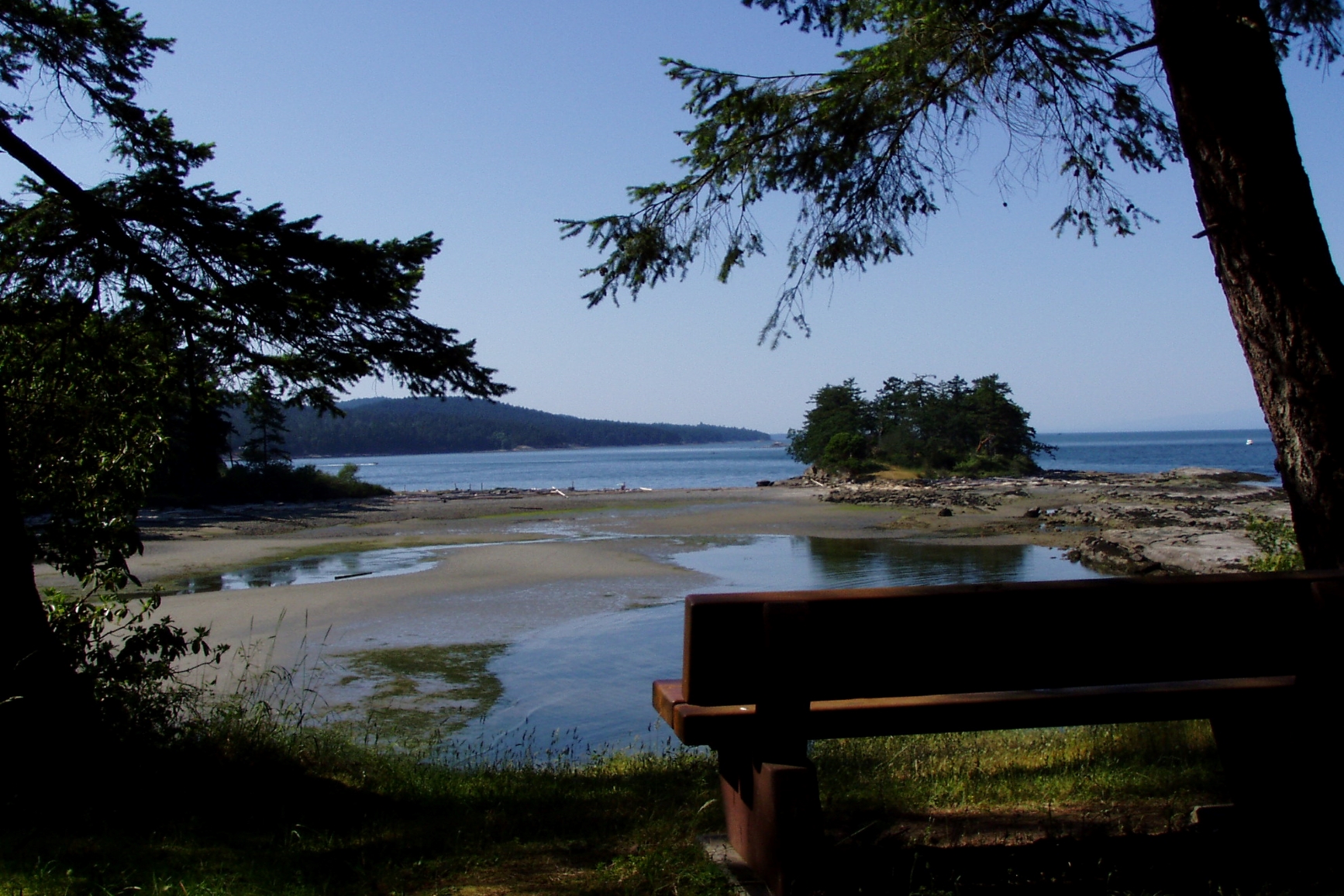 A picnic bench overlooking the sandy beaches and picturesque bays.