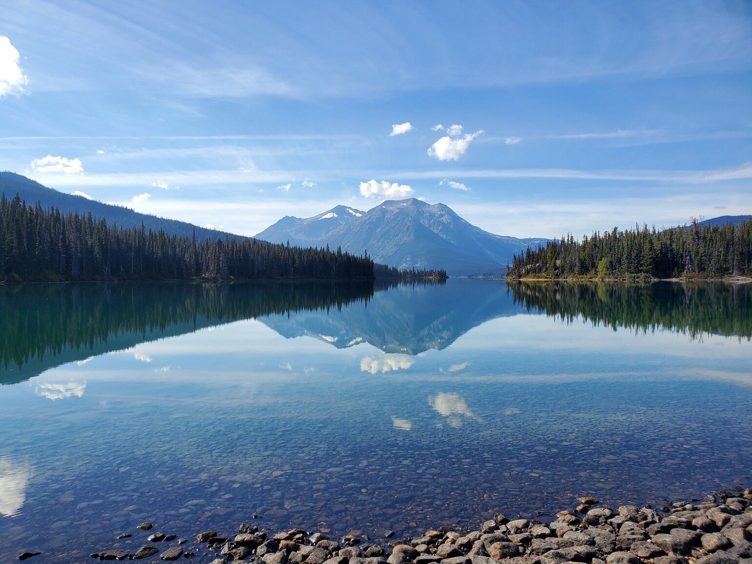 Pondosy Lake with Gable Mountain reflecting on the surface of the clear water. Tweedsmuir Park North.